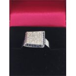 A 14ct white gold pave set sapphire and diamond ring