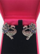 A pair of Marcasite and sapphire earrings in the form of dragons