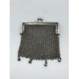 A silver Ladies coin purse, in a mesh style.