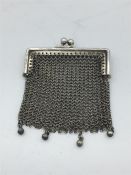 A silver Ladies coin purse, in a mesh style.