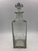 A square glass rum decanter