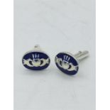 A pair of silver and enamel set Welsh cuff links