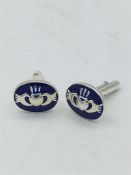 A pair of silver and enamel set Welsh cuff links