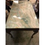A Green marble top coffee table