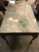 A Green marble top coffee table