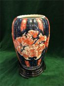 An Imari vase on stand