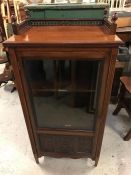 A galleried top mahogany display cabinet.