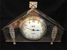 A white metal mantle clock by Connell of Cheapside London