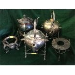 A selection of three plated teapots and five stands.