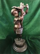 A Bronze statue of a Cherub, signed to base Rousseau