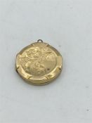 A 9ct gold, front and back, locket (Total Weight 2.8g)