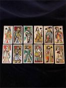 A set of twelve Carter tiles based on the Royal playing card characters of Jack Queen King of the