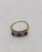 A ruby and diamond ring on a mount marked 18k