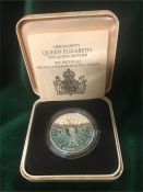 A boxed silver crown celebrating the Queen Mother's 80th Birthday