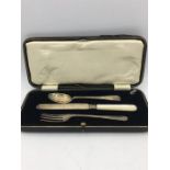 A hallmarked silver boxed set of knife fork and spoon.