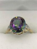 9ct gold with a mystic topaz and diamond shoulders