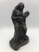 A cold cast figure by John Letts of Mother and Child