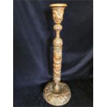 A Chinese carved candlestick