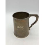 A hallmarked silver tankard engraved in 1948.