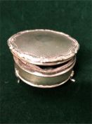 A silver three legged dish with lid, engraved AF