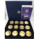 Crown Jewels coin collection, twelve in total, 24ct gold plated copper each coin has its