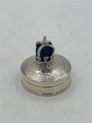 A Silver pill box with crown pincushion to the Lid.