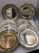 A set of eight hallmarked silver plates, hallmarked London 1955, probably Walter H Wilson