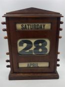 An Antique Wooden propelling calendar