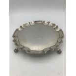 An Alexander Clark and Co Ltd scroll footed silver tray
