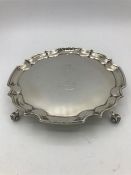 An Alexander Clark and Co Ltd scroll footed silver tray