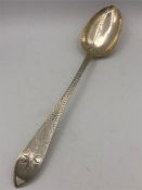 A hallmarked silver serving spoon, Dublin 1808. Total length 32cm, handle 22cm, bowl 10cm 110g.