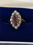 A 9ct gold ring with ruby and seed pearls