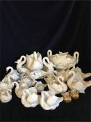 A large collection of porcelain, and china swans