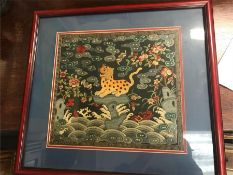 An Antique Chinese embroidered silk depicting a Leopard