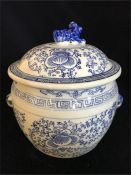 A Blue and white lidded Oriental style pot with Foo dog finial.