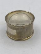 A hallmarked silver napkin ring