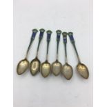 Six enamel on silver teaspoons