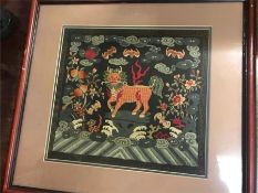 An Antique Chinese embroidered silk depicting a Lion