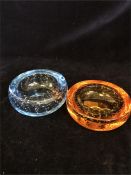 Two Whitefriars ashtrays with control bubbles, blue and amber.