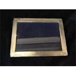 A silver picture frame, hallmarked.