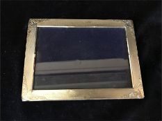 A silver picture frame, hallmarked.