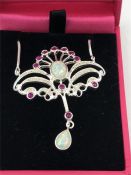 A Silver Art Nouveau style ruby and opal pendant necklace