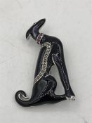 An Impressive silver Art Deco style enamel set dog brooch with ruby collar