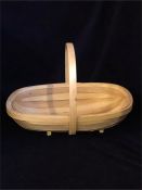 A wooden garden trug