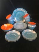 A Victoria Czech tea set of light blue and orange with a lustre finish, set of six.