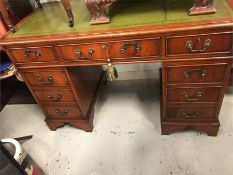 A leather topped pedestal desk