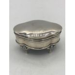 A hallmarked silver jewellery box on legs