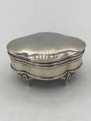 A hallmarked silver jewellery box on legs