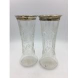 Two hallmarked silver topped glass vases.