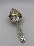 A Birmingham silver hallmarked tea strainer.